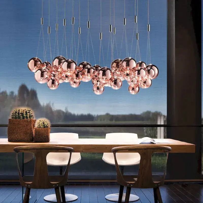 Modern rose gold spherical pendant light featuring decorbites glass ball orbs for dining room chandelier decor