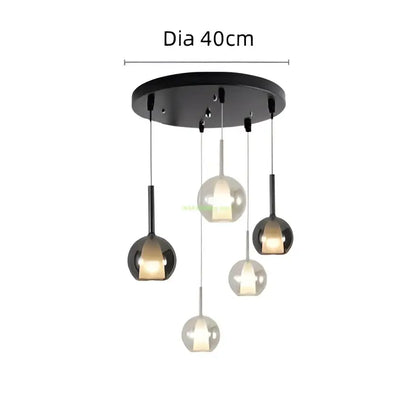 Modern chrome glass bubble pendant lights with black circular ceiling fixture and five hanging glass globe lights