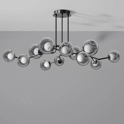 Modern black metal glass globe chandelier with clear glass spheres and exposed globe black LED bulbs for dining room lighting