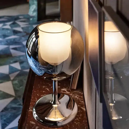 Modern chrome glass gold table lamp with a shiny chrome spherical base and frosted glass shade for luxury decorbites glow