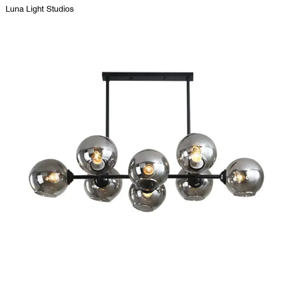 Modern black metal chandelier with seven smoked glass globe shades for stylish island lighting and e26 e27 bulbs