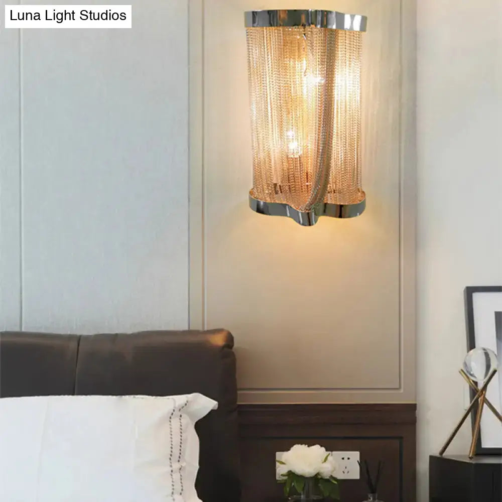 Modern chrome and gold crystal tassel wall lamp with cylindrical frame and cascading mesh chains for bedroom use
