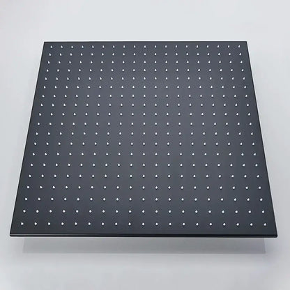 Black metal pegboard with evenly spaced white plastic holes for modern chrome rain shower head ceiling sprayer installation