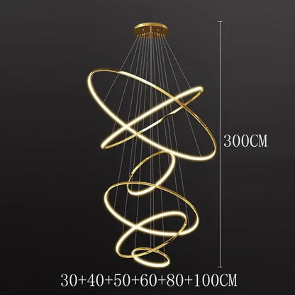 Modern chrome led ring pendant light with glowing golden spiral rings suspended by thin wires for living room use