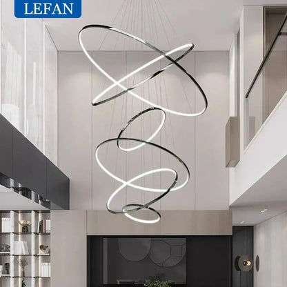Modern chrome pendant light with interlocking rings and integrated led bulbs ideal for living room spaces of various square meters