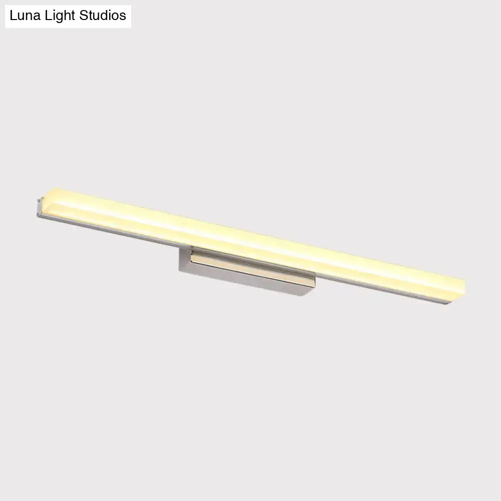 Modern chrome led wall light with streamlined metal shade in silver metal frame and warm white diffused illumination