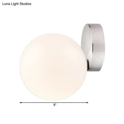 Modern chrome milk glass globe wall lamp with frosted glass and polished chrome bracket for living room lighting