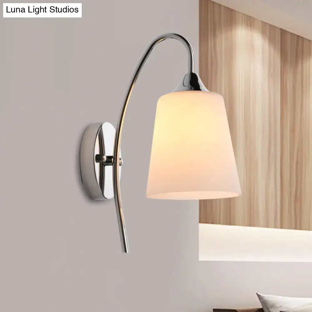 Modern chrome milky glass trumpet wall sconce with curved arm and frosted shade for stairway lighting