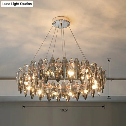 A two-tiered minimalist oval crystal clear pendant chandelier with faceted teardrop glass on chrome 220v-240v ceiling mount