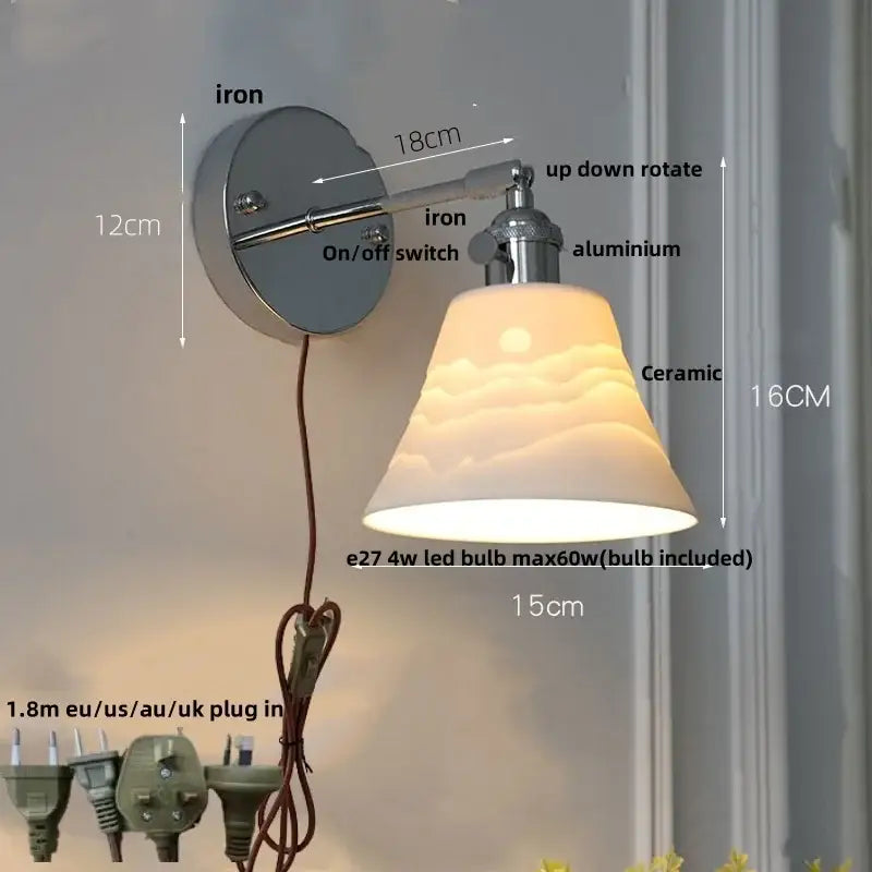 A modern chrome ribbed clear glass wall lamp with ceramic sunrise shade and metallic iron aluminum arms decorbites clear glass