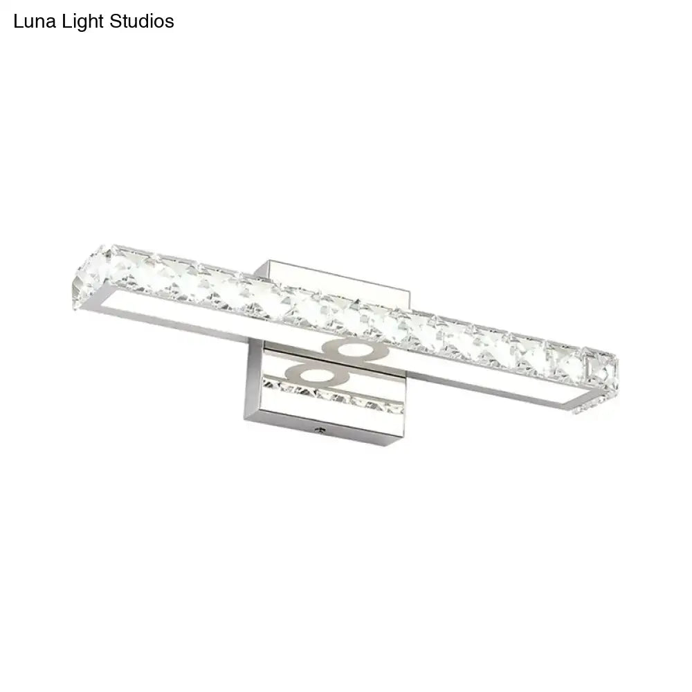Modern chrome and silver champagne linear wall sconce with clear faceted crystal accents for bathroom lighting