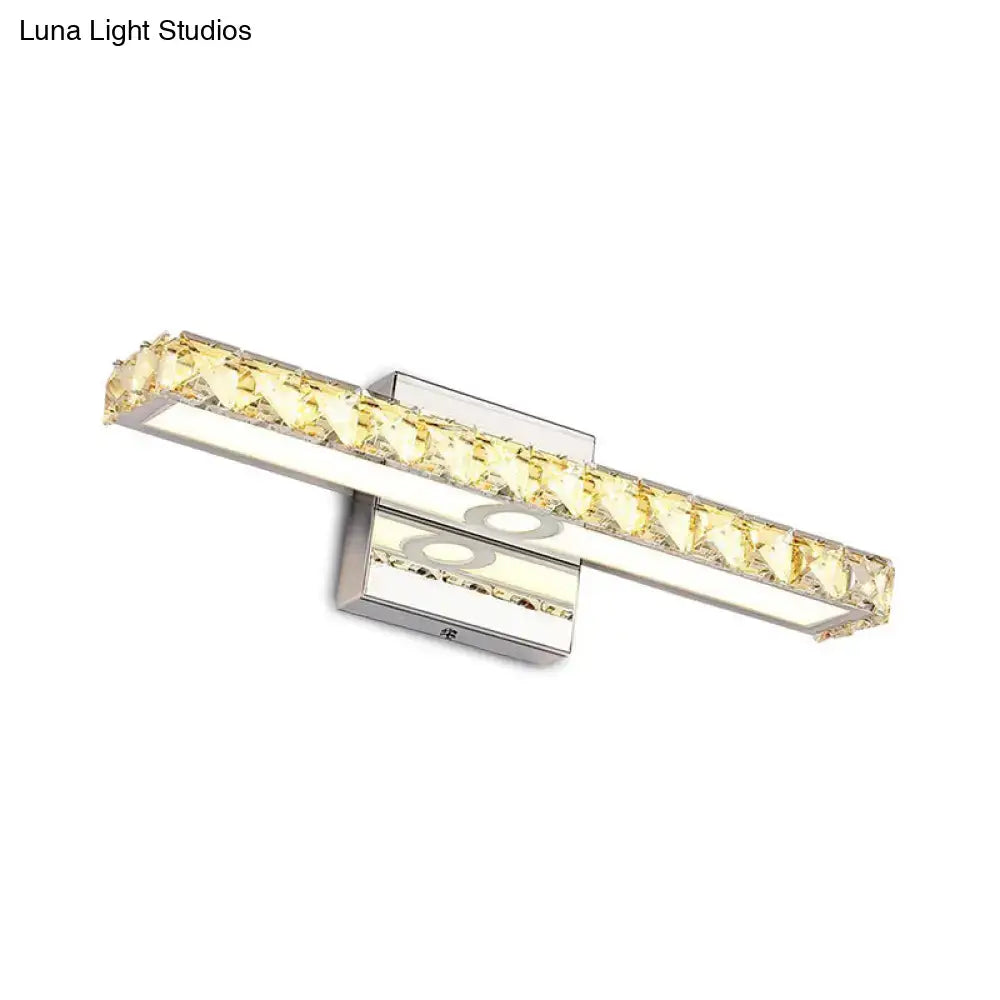 Modern chrome and silver champagne linear wall sconce with sleek chrome finish and yellow crystal accents for bathroom use