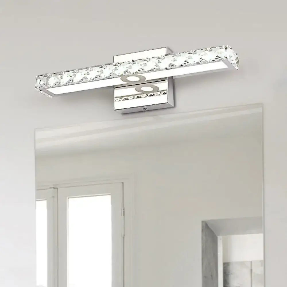 Modern chrome and silver champagne linear wall sconce bathroom light with sleek rectangular design and clear crystal accents
