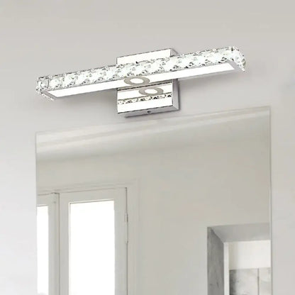 Modern chrome and silver champagne linear wall sconce bathroom light with sleek rectangular design and clear crystal accents