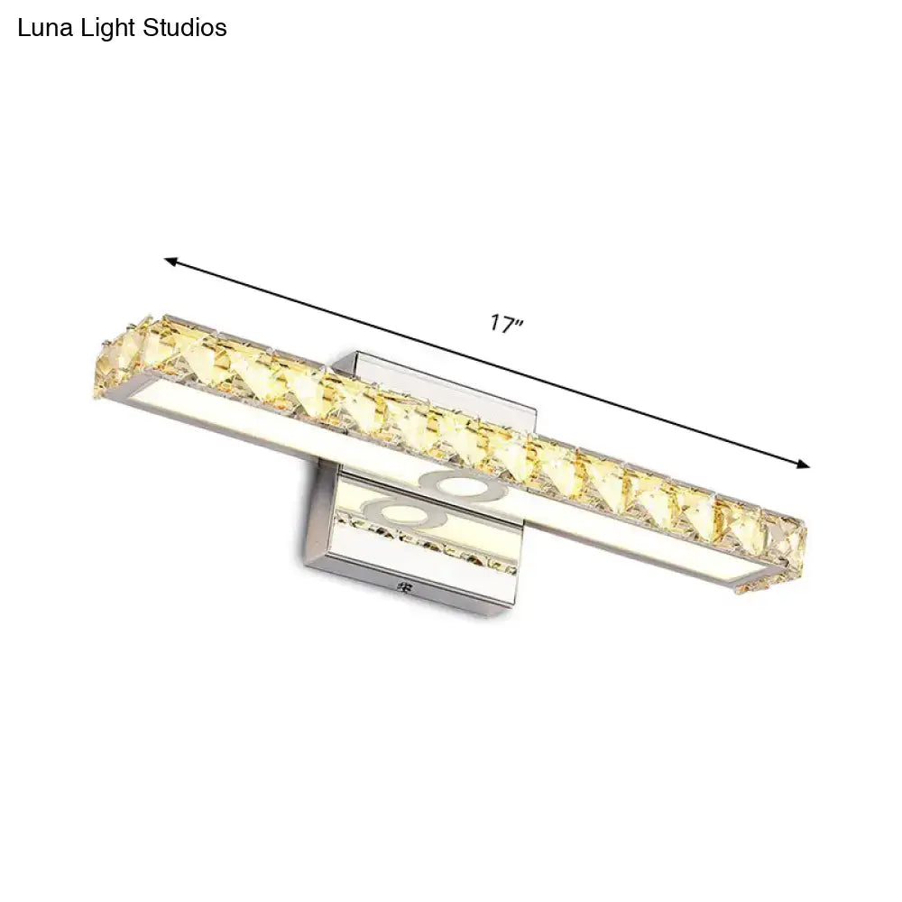 A sleek 17-inch modern silver champagne linear wall sconce with chrome finish and embedded yellow crystal accents