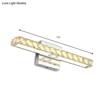 A sleek 17-inch modern silver champagne linear wall sconce with chrome finish and embedded yellow crystal accents