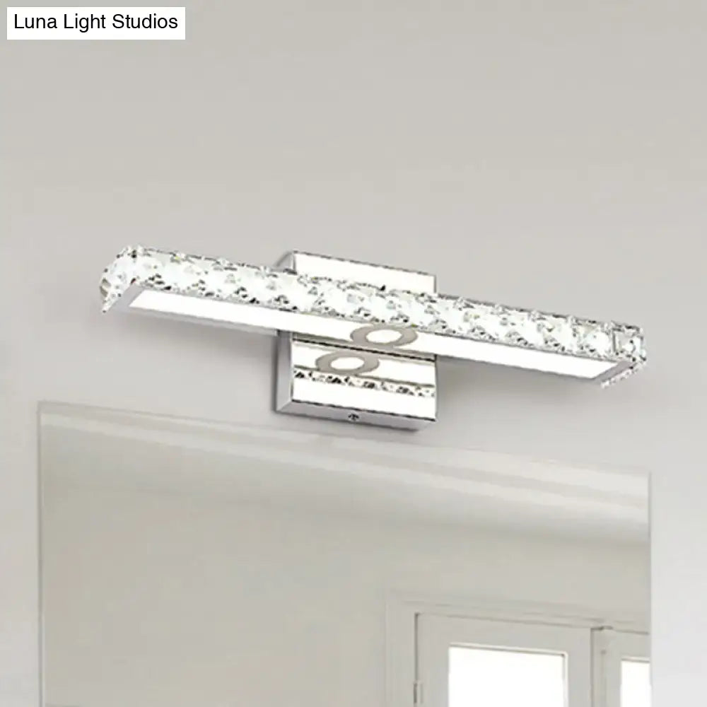 Modern chrome and silver champagne linear wall sconce with embedded clear crystals for bathroom lighting