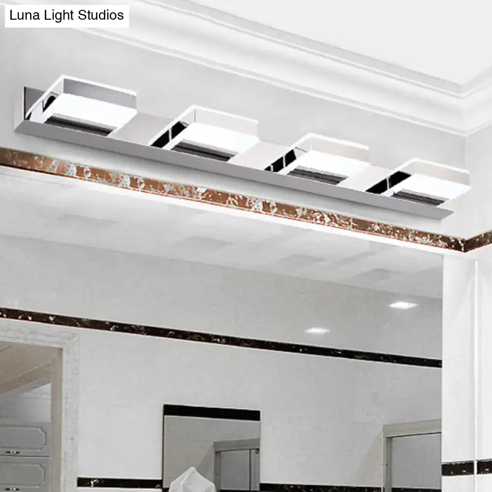 Modern white rectangular led bathroom light fixture with chrome accents and minimalist design highlighting fixture height