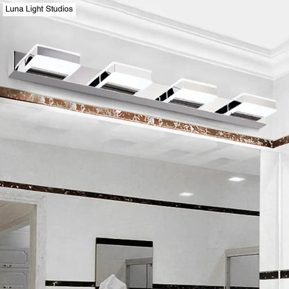Modern white rectangular led bathroom light fixture with chrome accents and minimalist design highlighting fixture height