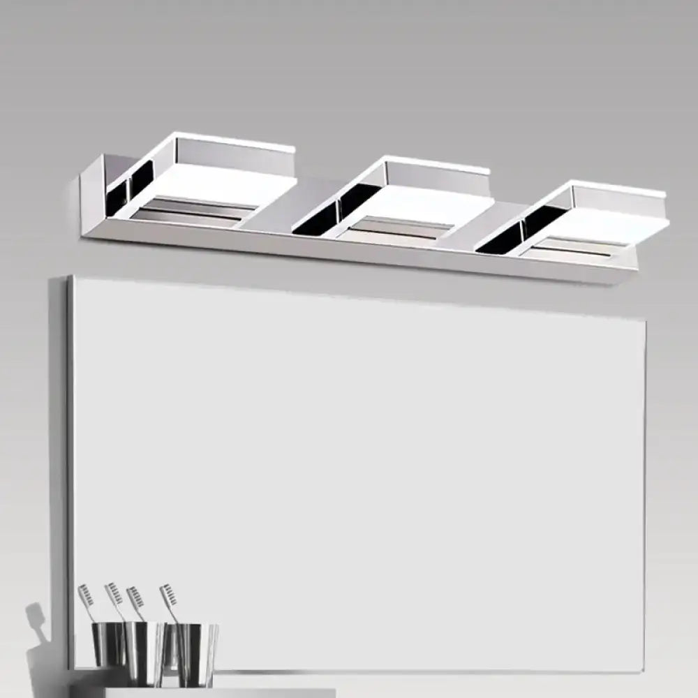 Modern chrome three-light vanity fixture with sleek rectangular panels and integrated led bulbs featuring fixture height