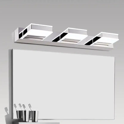 Modern chrome three-light vanity fixture with sleek rectangular panels and integrated led bulbs featuring fixture height
