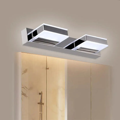 Modern chrome bathroom vanity fixture with two rectangular led panels and sleek angular design highlighting fixture height