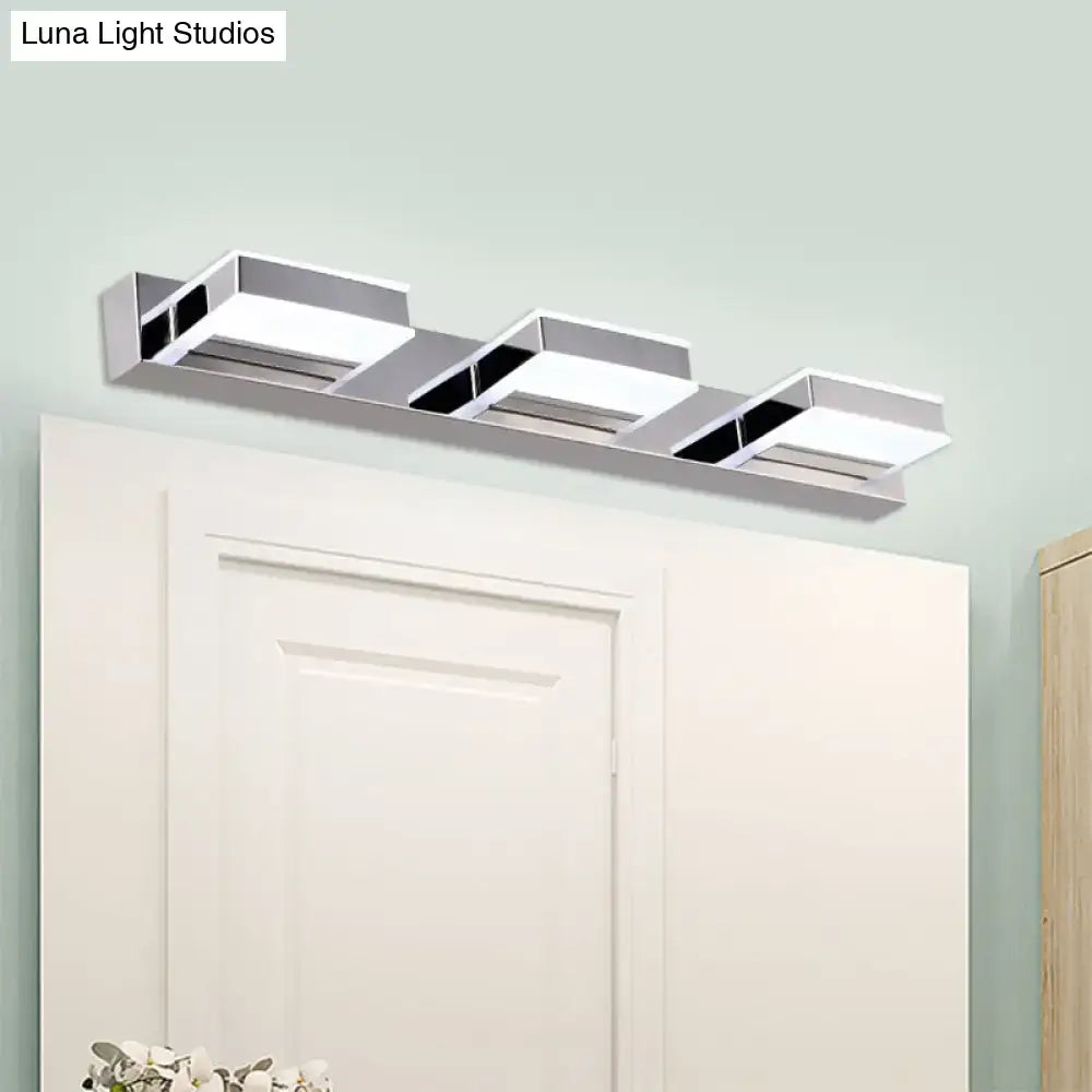 Modern chrome square acrylic vanity light with three rectangular panels and black accents emphasizing fixture height