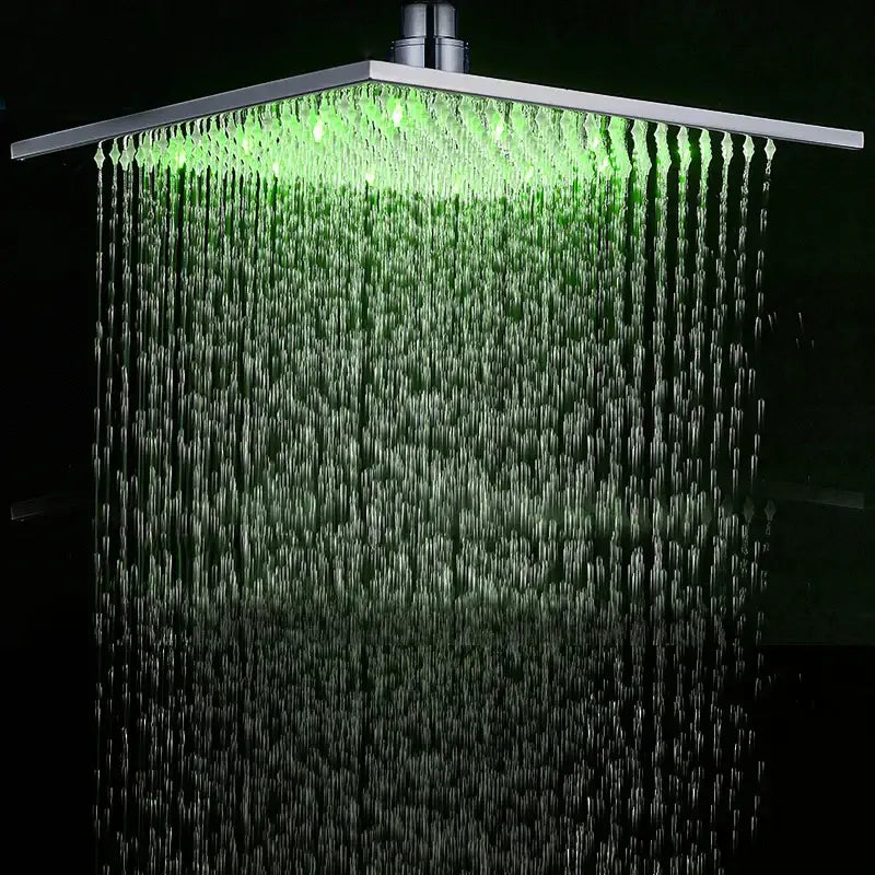 Modern chrome square led rainfall shower head with brushed metallic finish and green led light illuminating water streams