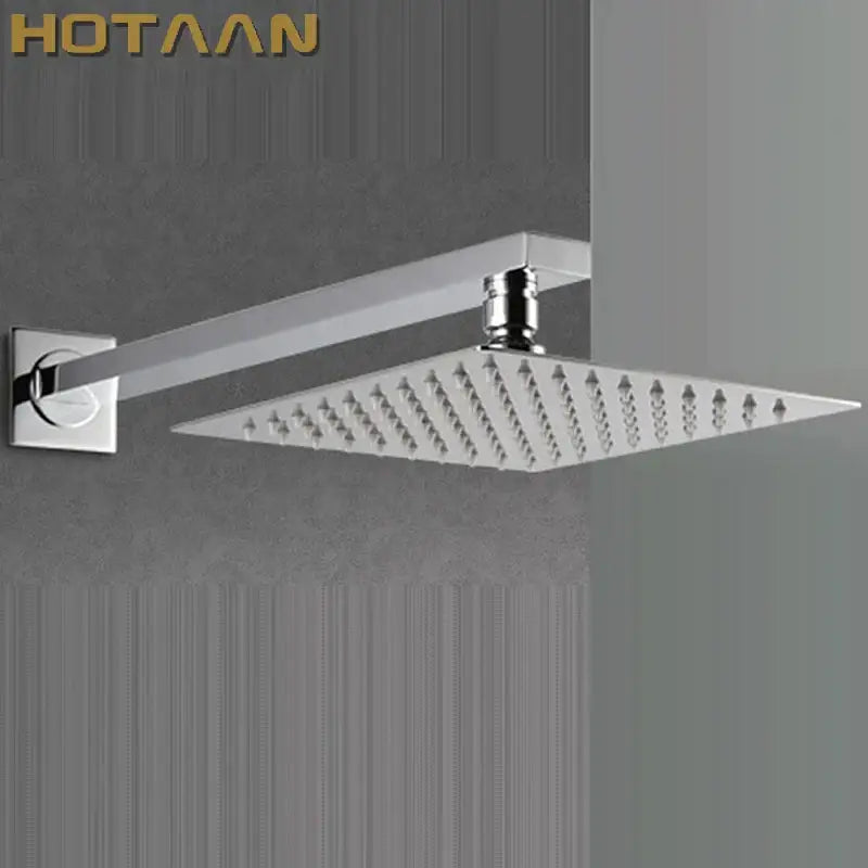 Modern chrome square rain shower head with arm featuring multiple water jets and a minimalist design for bathroom use