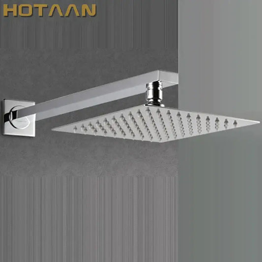 Modern chrome square rain shower head with arm featuring a sleek design and multiple water jets for bathroom use