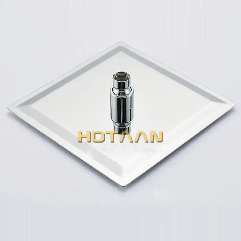 Modern chrome square rain shower head with cylindrical chrome finish and threaded top resting on white plate