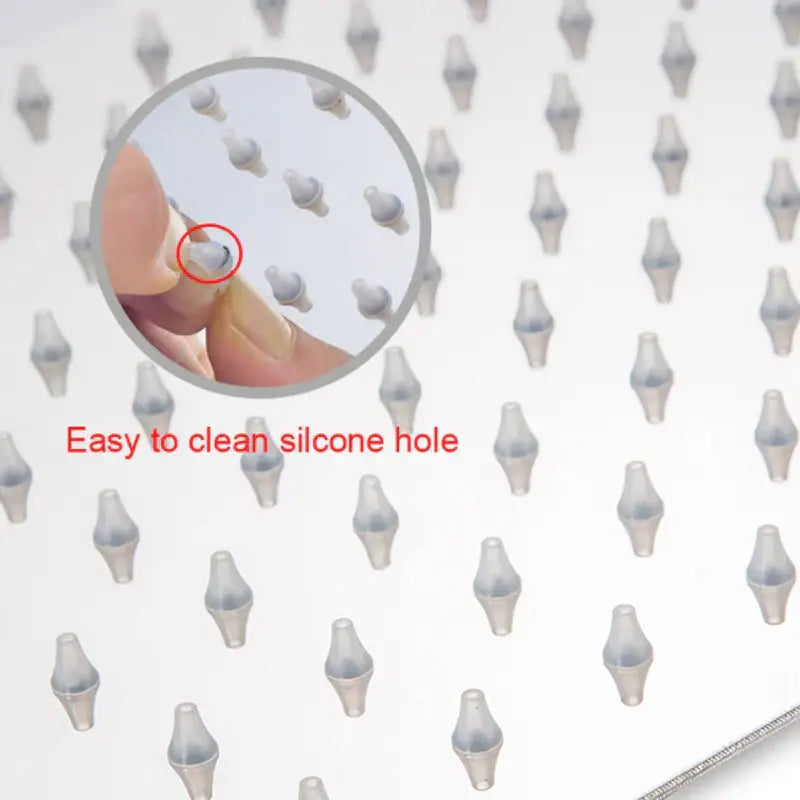 Modern chrome square rainfall shower head featuring transparent silicone nozzles with a smooth tapered design