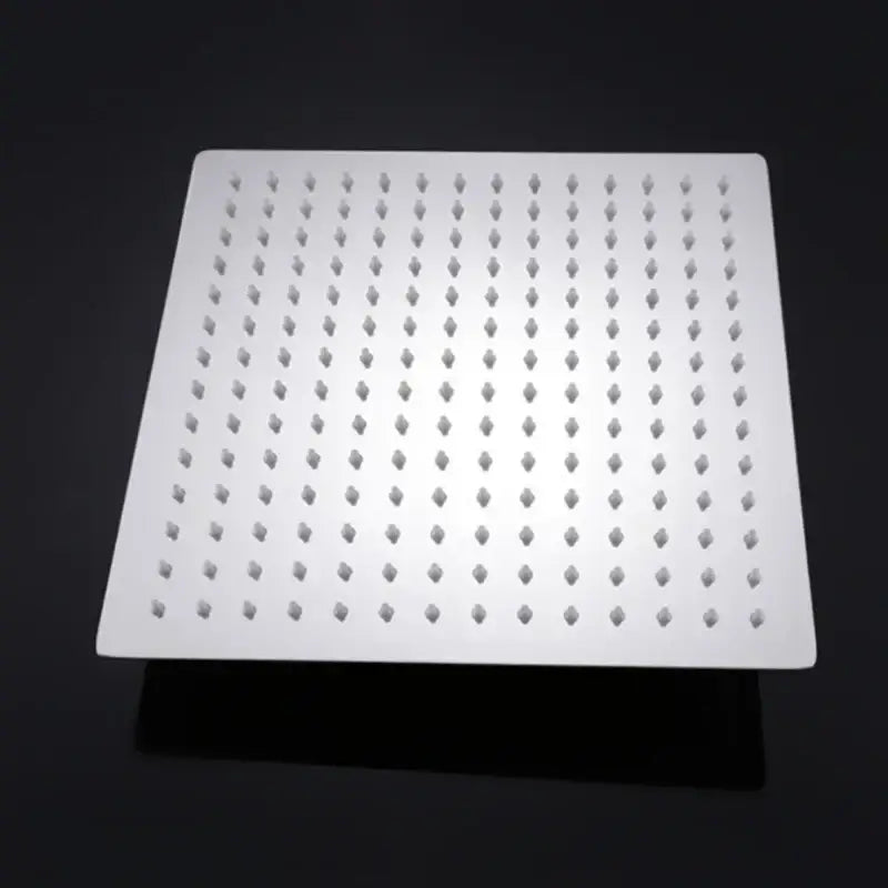 Modern chrome square rainfall shower head with white diamond-shaped nozzles for an elegant rainfall shower experience