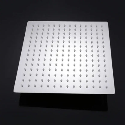 Modern chrome square rainfall shower head with white diamond-shaped nozzles for an elegant rainfall shower experience