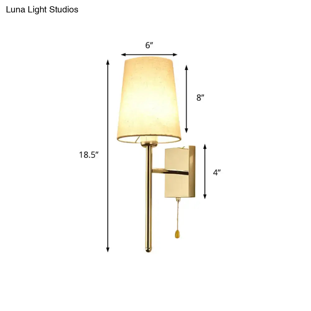 Gold-finished tapered wall sconce with beige fabric shade and rectangular backplate modern chrome tapered wall light