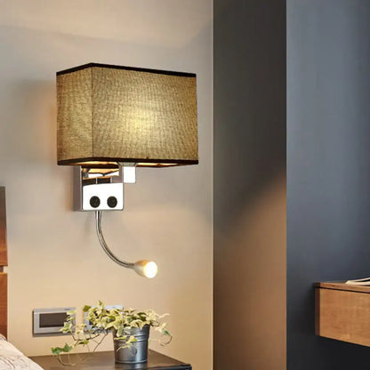 Modern chrome wall lamp with textured beige fabric shade and adjustable gooseneck reading light for bedroom use
