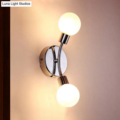 Modern chrome wall lamp with white glass fixture featuring two spherical frosted glass bulbs and chrome bulb base