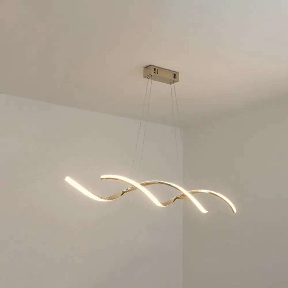 Modern gold-toned chrome wave led island lighting with sleek curved design and three intertwined light strips for kitchen pendant light