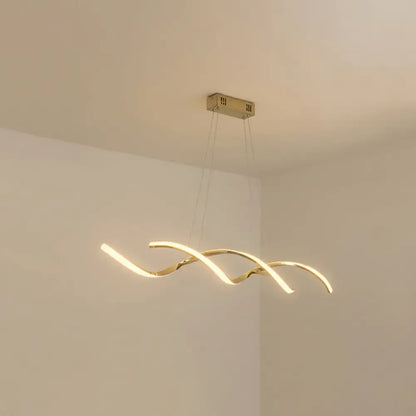 Gold-toned modern led island lighting with a sleek curved design and warm ambient kitchen pendant light illumination