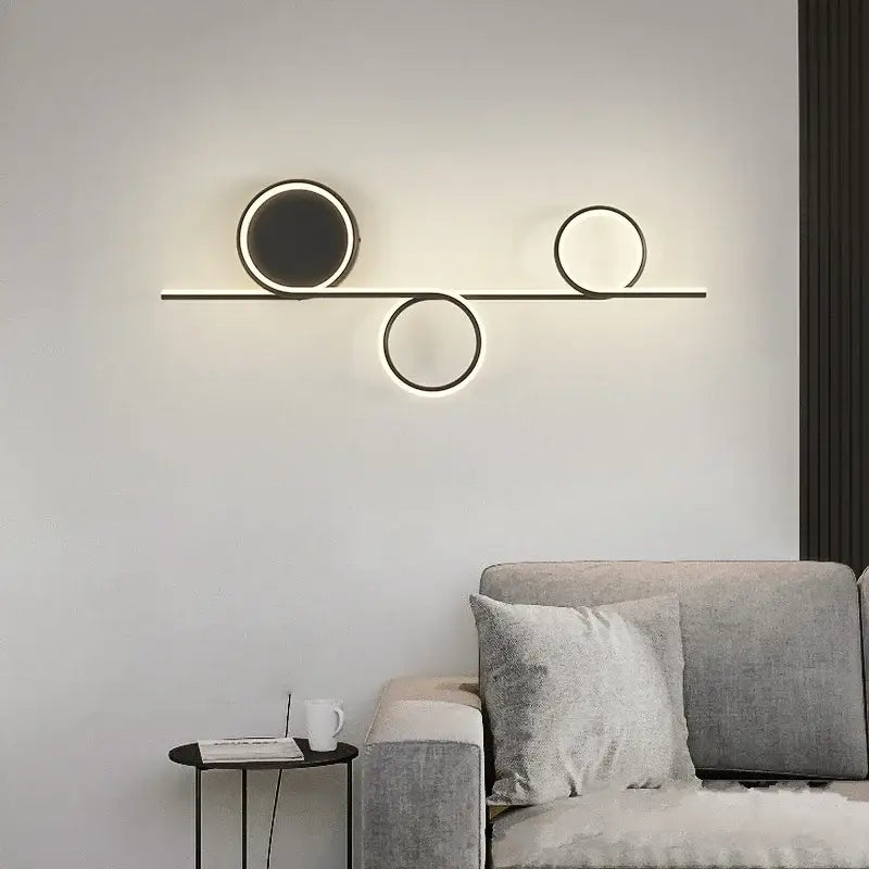Modern circle straight bar wall lamp with three black metal circular led lights for bedroom and living room decorbites circle straight