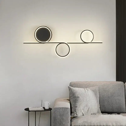 Modern circle straight bar wall lamp with three black metal circular led lights for bedroom and living room decorbites circle straight