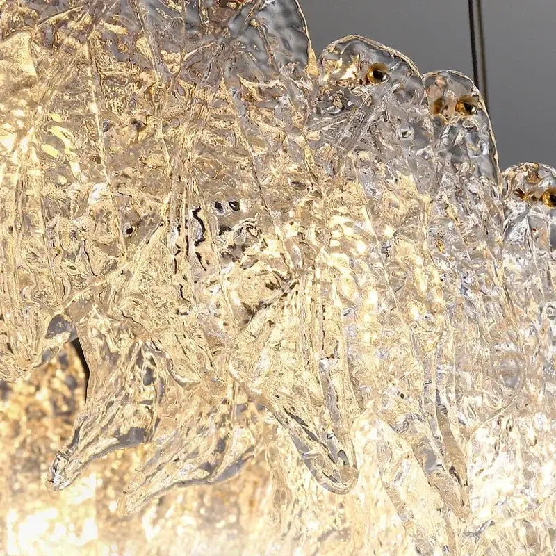 Modern circular glass petal led chandelier with translucent textured glass and golden accents for dining room lighting