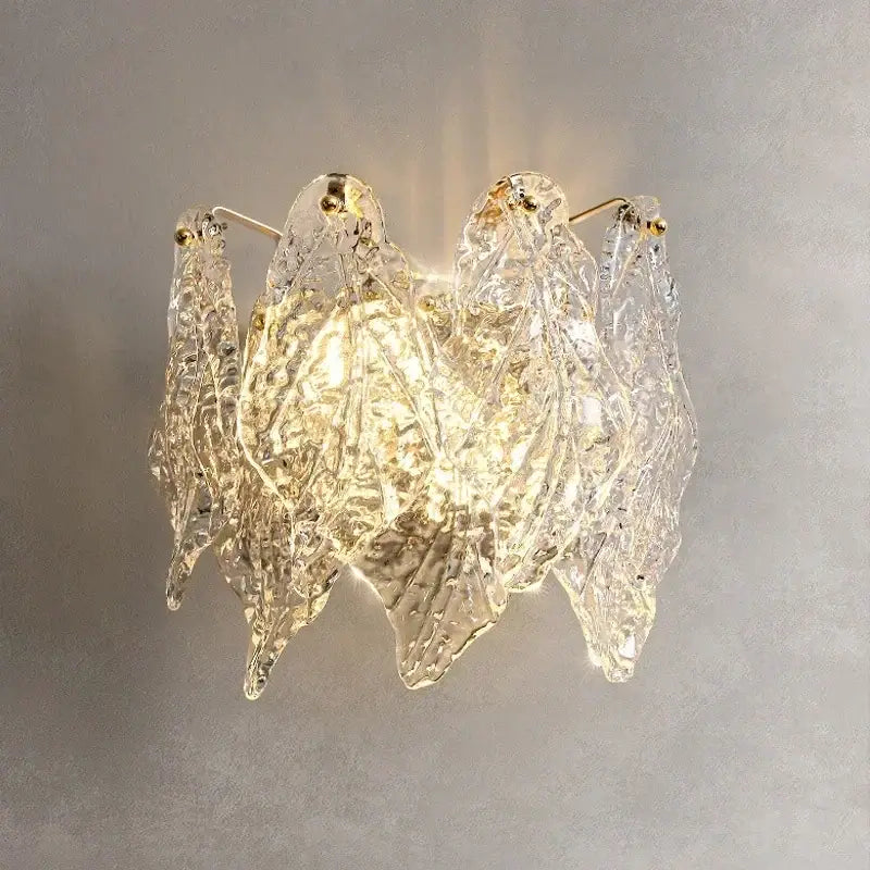 Modern circular glass petal led chandelier featuring clear textured glass leaf-shaped sconces with gold-toned accents