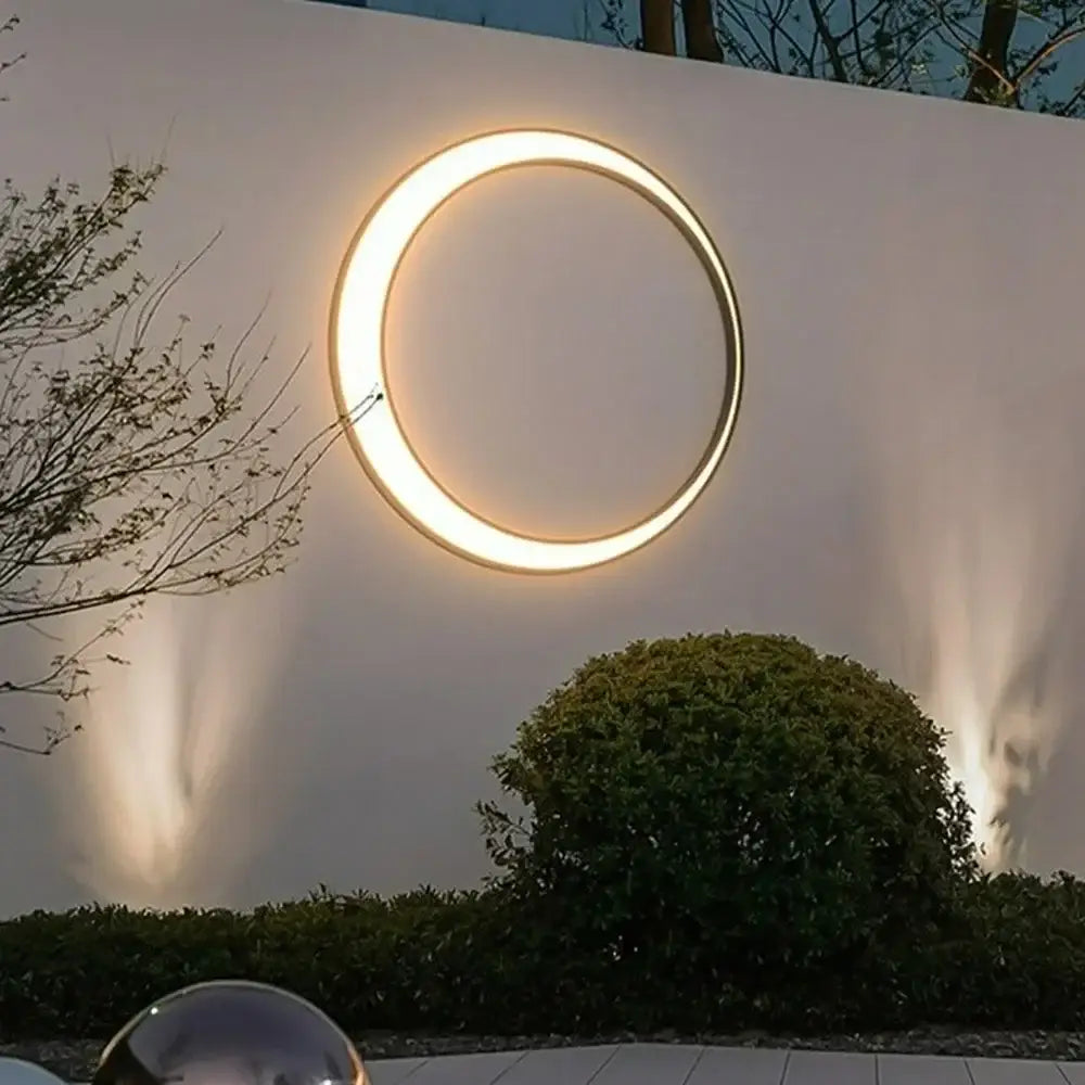 Modern circular led wall lamp with warm glowing illumination for outdoor space decorbites elegant curved design