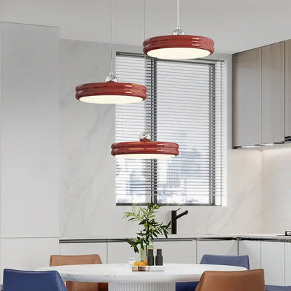 Three vibrant red circular modern chandelier pendant lights with glossy finish for dining room decorbites circular modern design