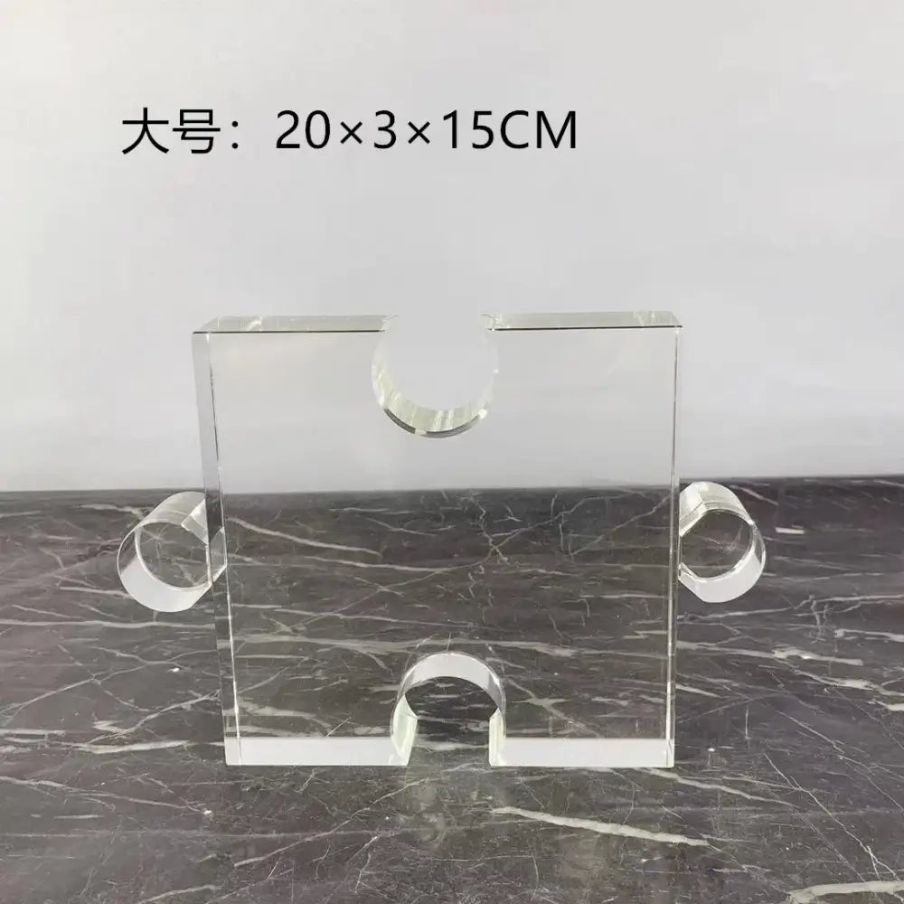 Modern clear acrylic geometric puzzle bookends with rectangular base and circular handles for decorbites crystal geometric display
