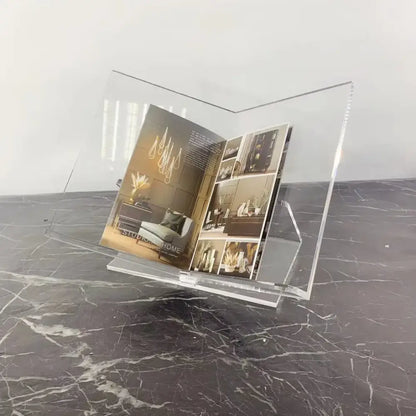 Modern clear acrylic geometric magazine rack holding an open magazine for office desktop storage by decorbites acrylic geometric bookshelf