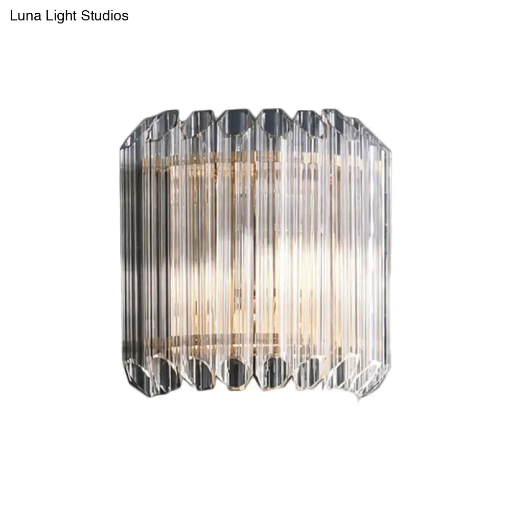 Modern clear crystal half drum bedroom wall sconce light fixture with faceted glass and geometric design