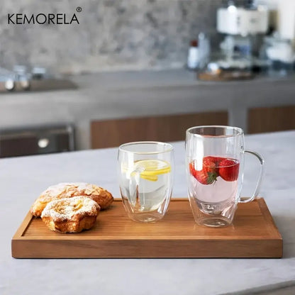 Modern clear double wall glass coffee mug set with handles featuring lemon and strawberry infused drinks