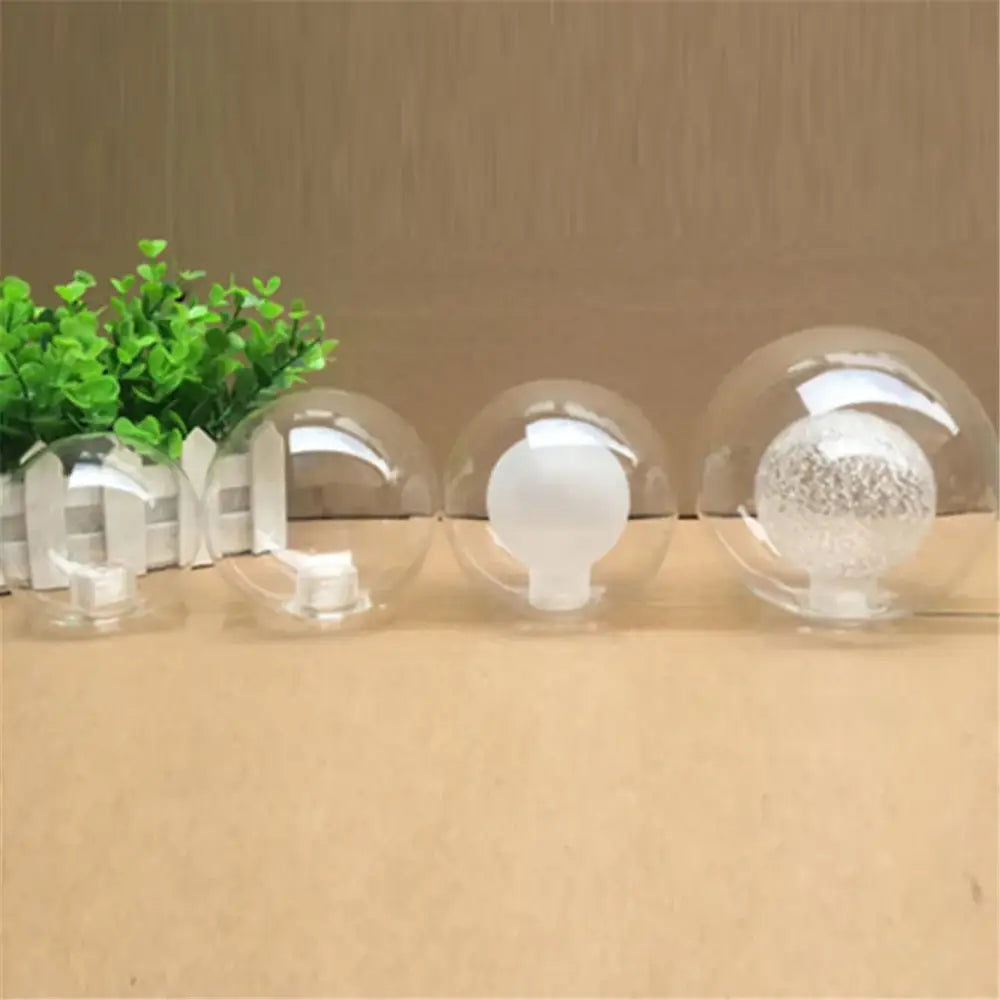 Modern clear and frosted glass shade cover replacement featuring spherical glass ornaments with white decorative items inside